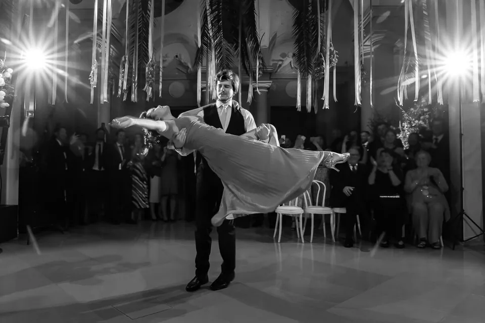 Striking first dance of the wedding couple in black and white