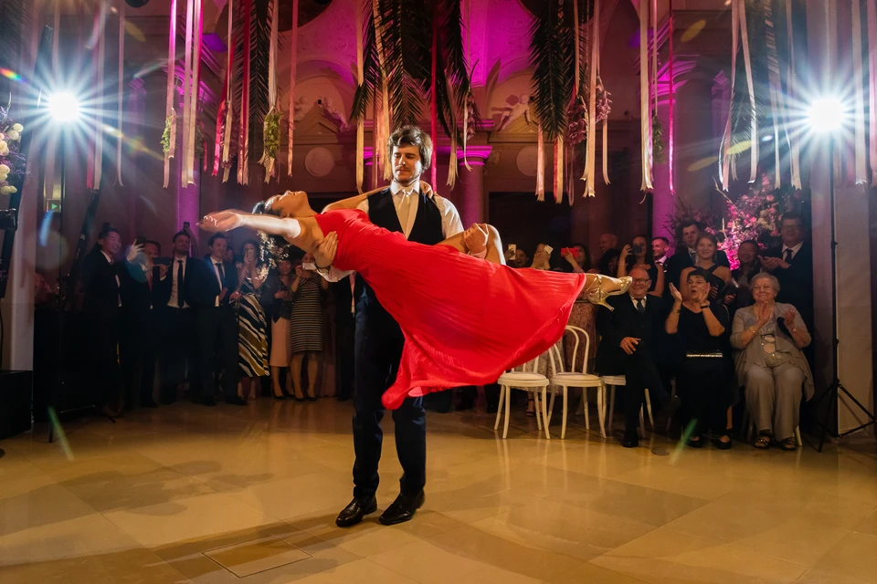 Wedding couple during their first dance in the festively decorated hall of Palais Liechtenstein
