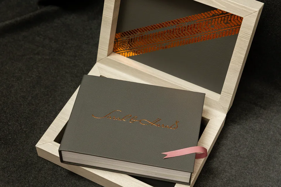 Finished wedding album in a handcrafted wooden box with satin ribbon