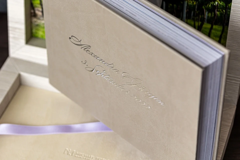 Suede wedding album with individual embossing and a satin ribbon