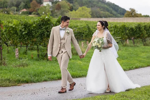 Lesbian wedding couple surrounded by greenery