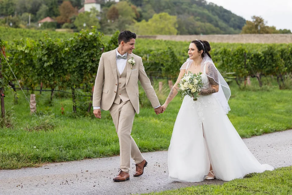 Lesbian wedding couple surrounded by greenery