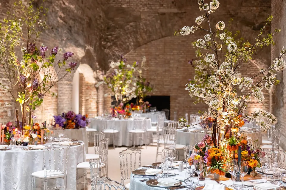 Festively set wedding table in the vaulted casemates of Palais Coburg