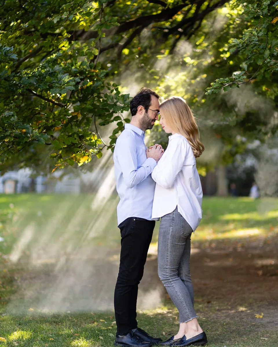 Couple in love in the morning mist in the Burggarten Vienna